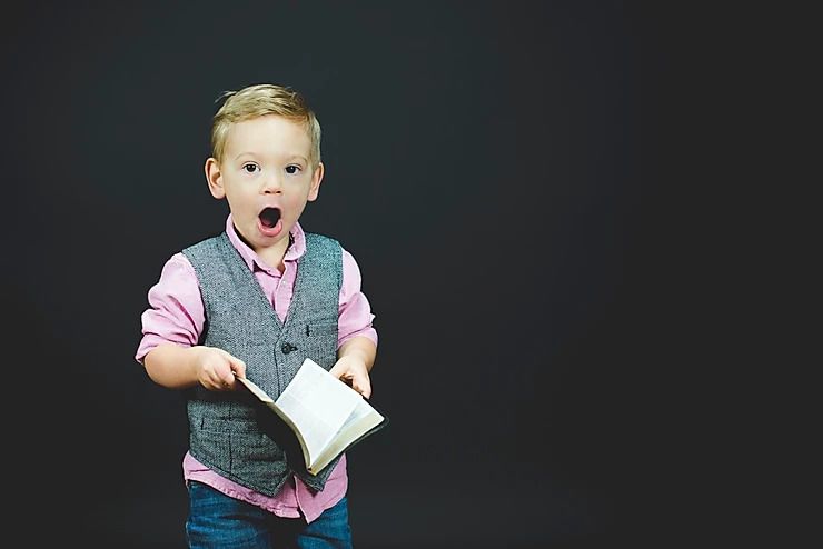 Young child holding a book