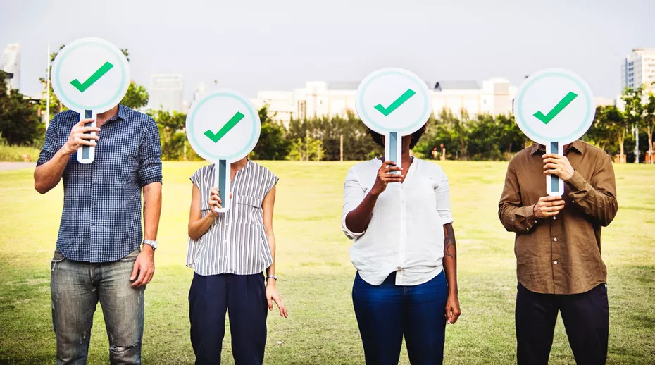 People Standing With Tickmarks